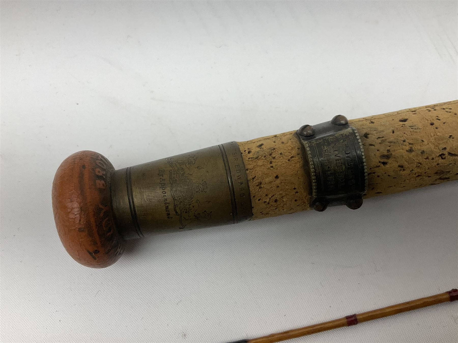 Hardy 'The Sir Edward Grey' two piece split can fishing rod, with cork handle and brass fittings marked Hardys, with a Hardy cover