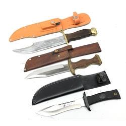  Bowie type knife, 20cm single edge blade stamped Crocodile Hunter, brass crossguard and pommel with shaped grip, L33.5cm in sheath with sharpening stone, another 15cm blade marked Alce Spain Inox, composition guard, grip and sheath, L27cm, another, 16cm single edge blade with brass bound wooden slab grip, L28cm in leather sheath (3)  