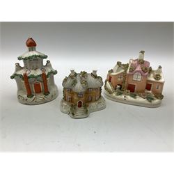 Group of Victorian Staffordshire, and later Staffordshire style buildings, some pastille burners, one example a money box. 