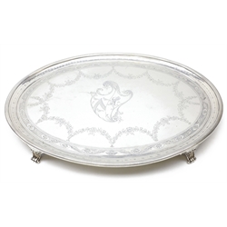  Oval silver tray with bright cut decoration and crest, maker's mark double stamped R.B, probably Irish 18th century with later 800 standard feet, current assay office mark LAO (APC)9248, L55cm  approx 81oz gross  