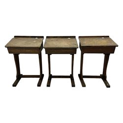 Three pitch pine school desks, each with