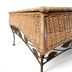 Basket work coffee table featuring scrolling leaf edging on tapered lags
