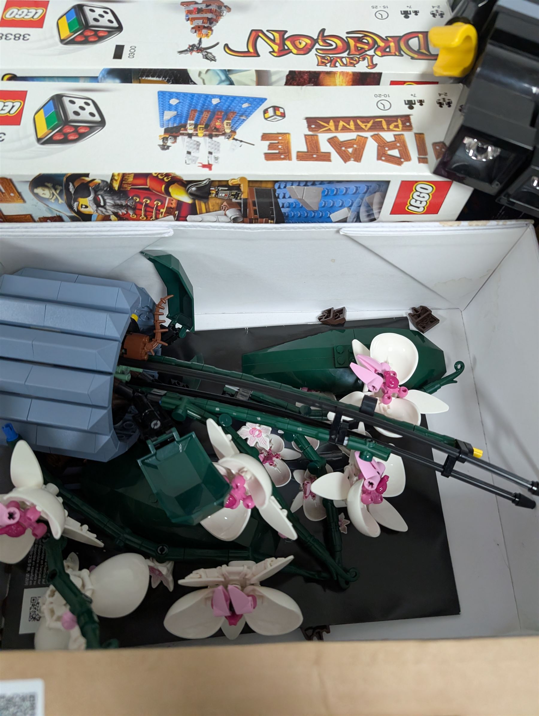 Lego, including partially built Lego Botanicals Orchid, minifigure torch light, five Lego Games including Harry Potter Hogwarts game, Lava Dragon, Pirate Plank, UFO Attack and Meteor Strike 