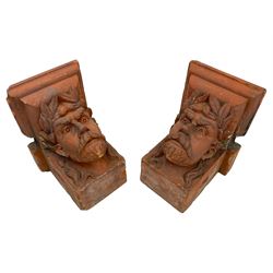 Jabez Thompson (Northwich 1838-1911) - pair of Victorian terracotta wall brackets or corbels, stepped ovolo cornice over masks in the form of a Classical male, wearing a laurel wreath with moustache and beard, stamped to underside