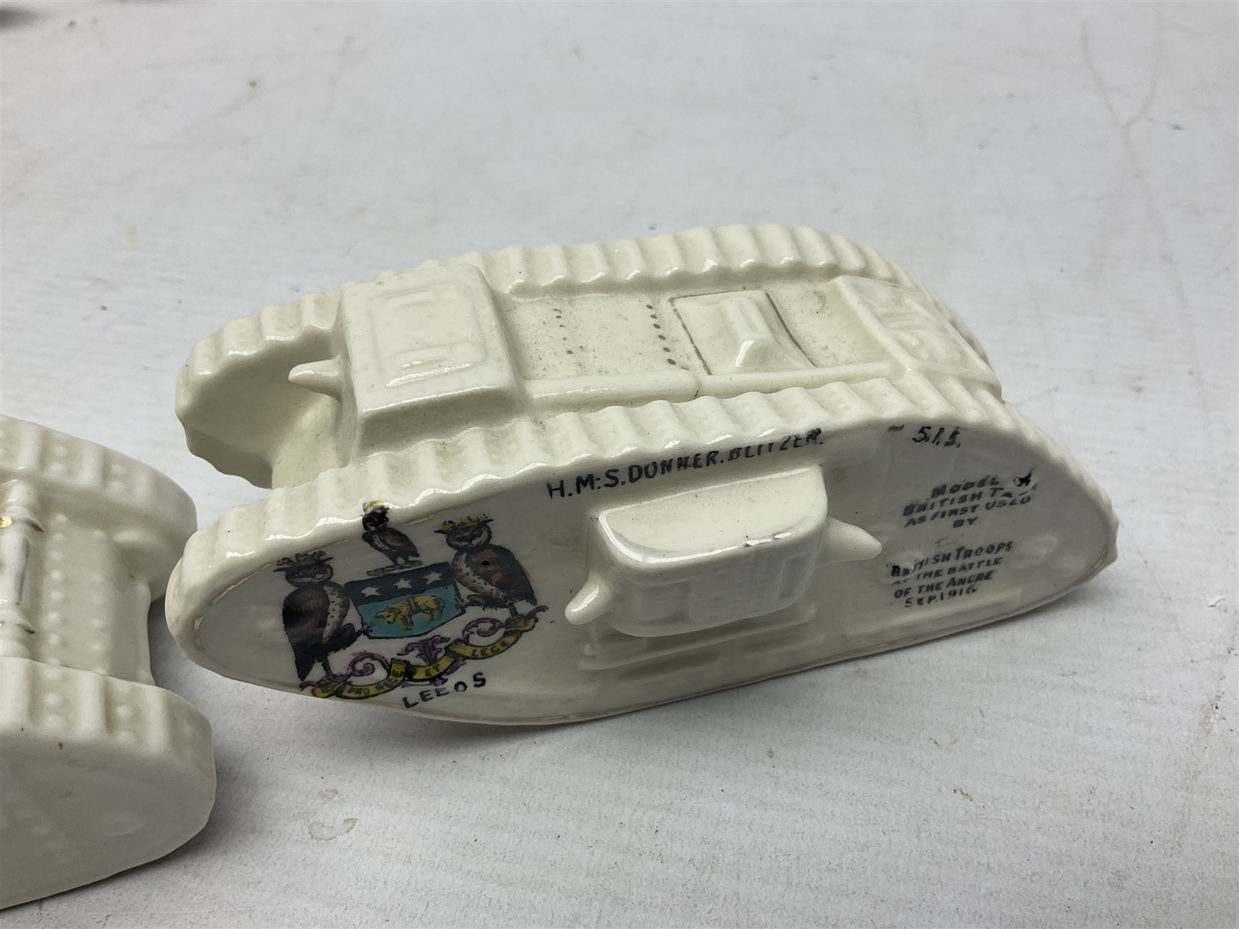 Twelve crested china models of WW1 tanks by Grafton, Arcadian and Carlton china etc with crests from Caistor Lincs, Saffron Walden, Paignton, Evesham etc  , together with a crested china model of the R.M.S Lusitania with New Brighton crest and a two-handled vase for 'The Forts Boxhill' (14)