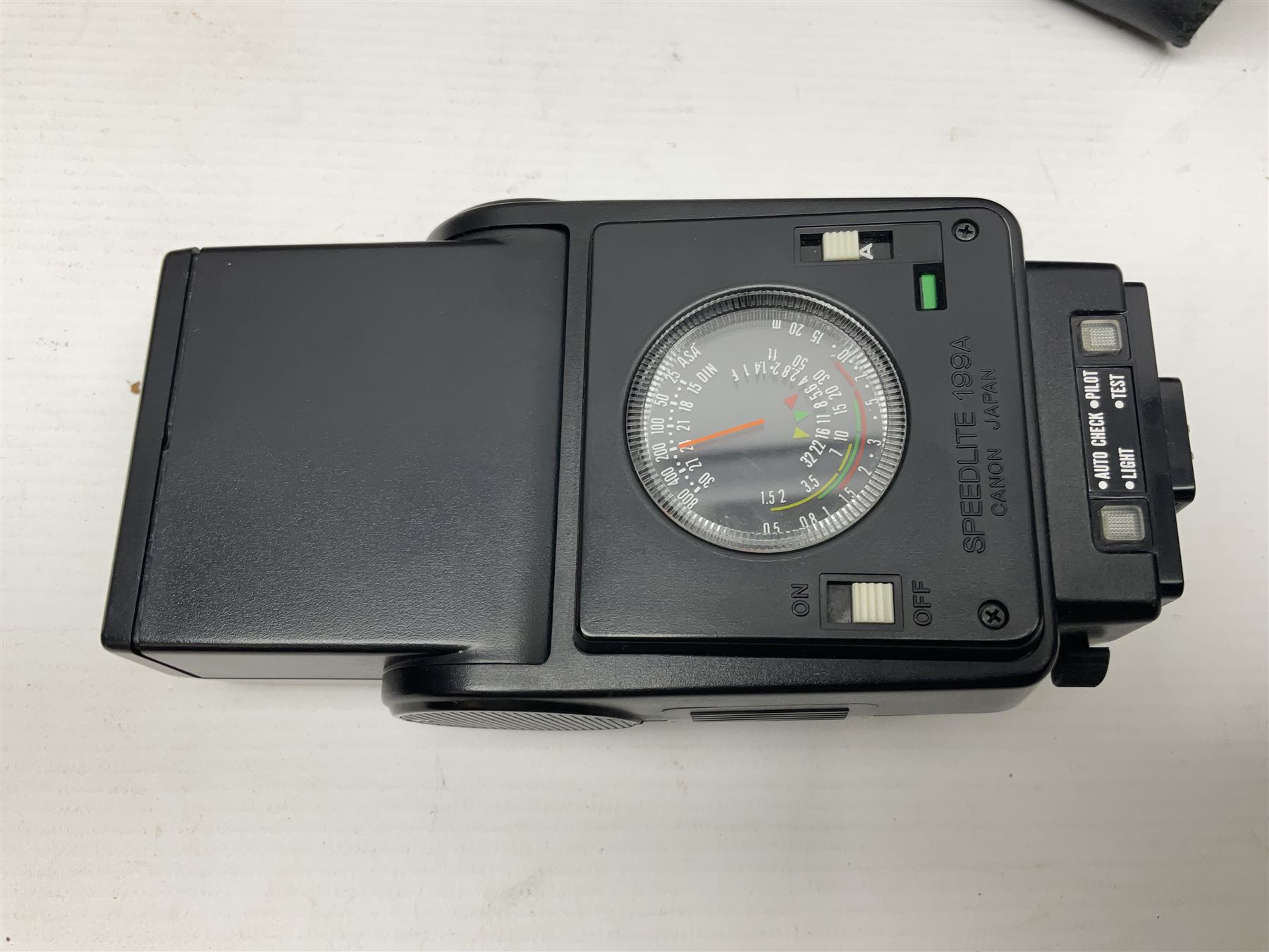 Canon A1 35mm camera body serial no 741264, with 'Tokina AT-X 28-85mm 1:3.5-4.5' lens serial no 821679, 'Canon FD 50mm 1:1.8mm' lens and other camera equipment 