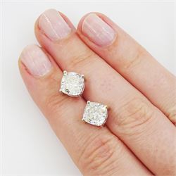 Pair of 18ct white gold cushion cut diamond stud earrings, stamped, total diamond weight, 4.48 carat, each diamond with GIA certificate