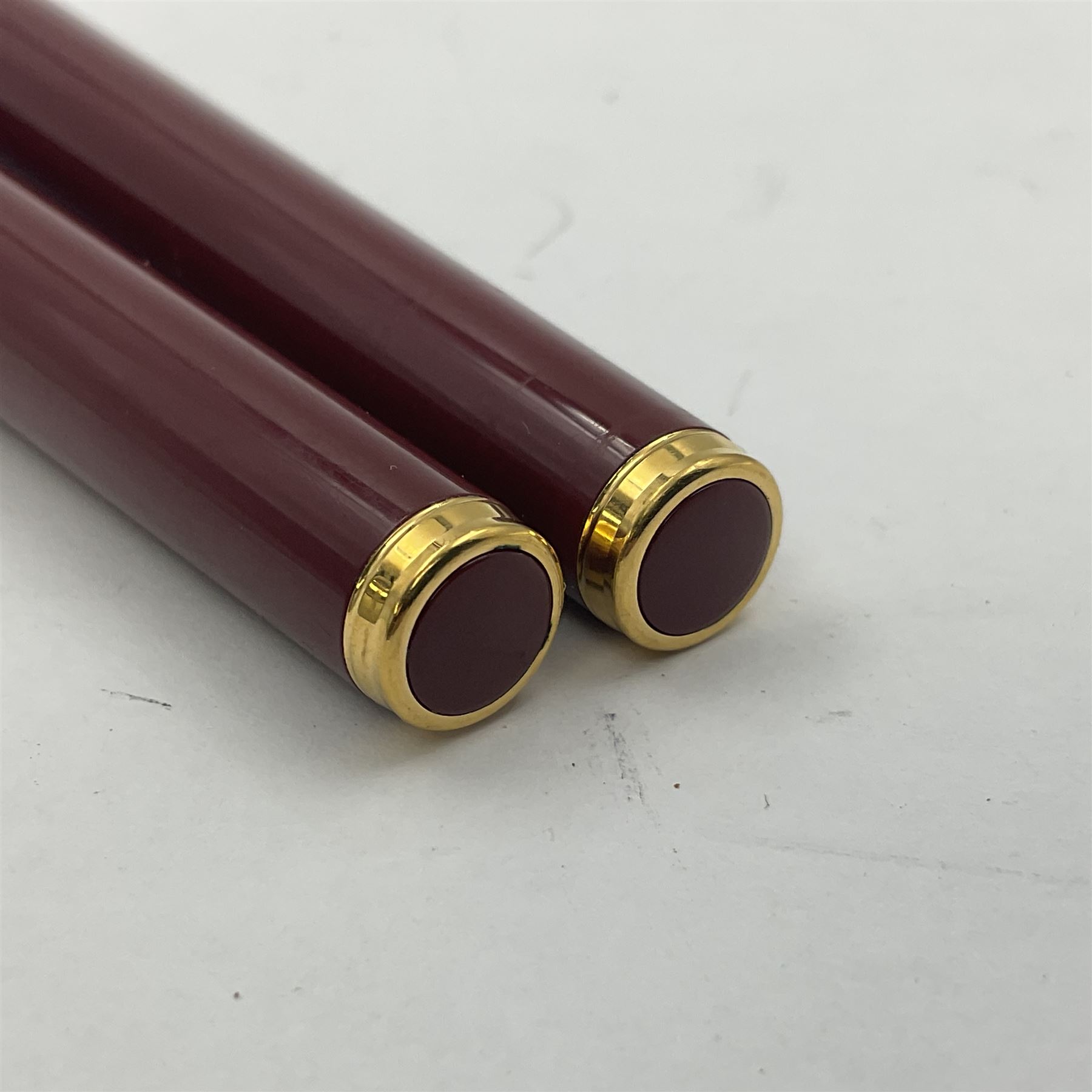 Montblanc Noblesse Oblige fountain pen, the maroon barrel and cap with gilt clip and mounts and nib stamped 585 14K/ct, together with a matching ballpoint pen, largest L14cm (2)