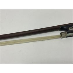 19th century wooden violin bow with a decorative mother of pearl inlay depicting flowers to the frog, with a bone adjuster screw