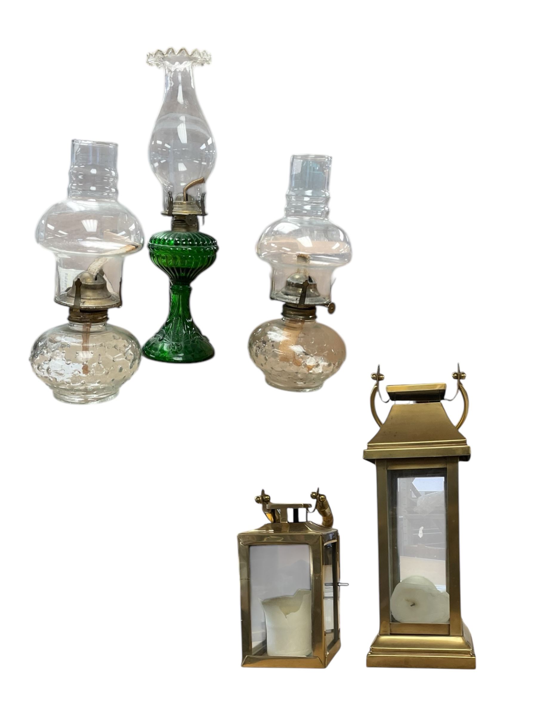 Pair of oil lamps, with impressed mark beneath Farms Lamp Light, together with another oil lamp and two lanterns  