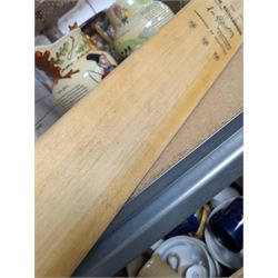 Two signed cricket bats, with signatures including Colin Cowdrey