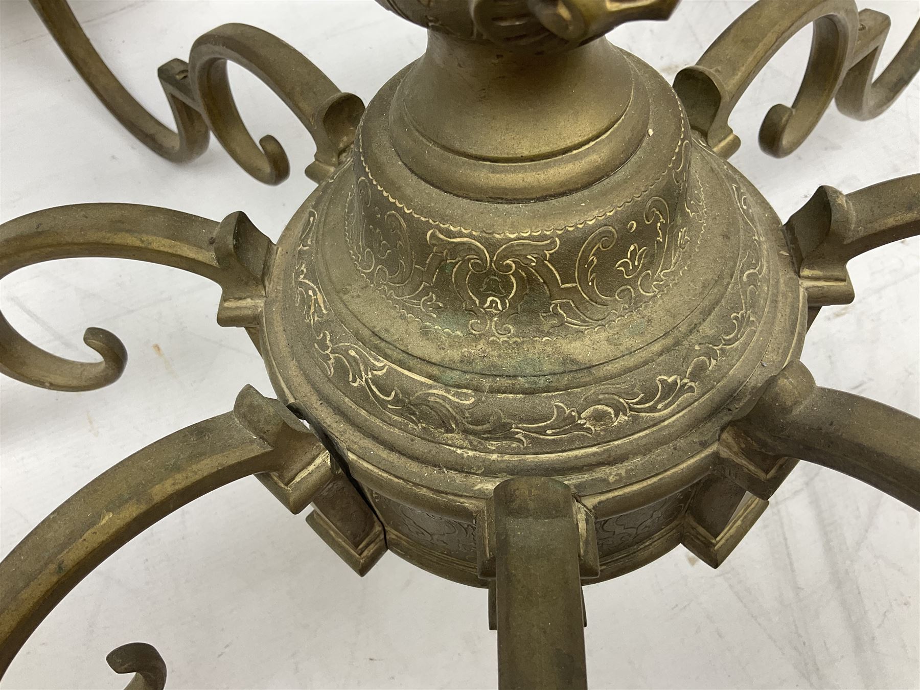20th century heavy brass eight branch electrolier, detailed with putti masks, approximately H60cm W71cm