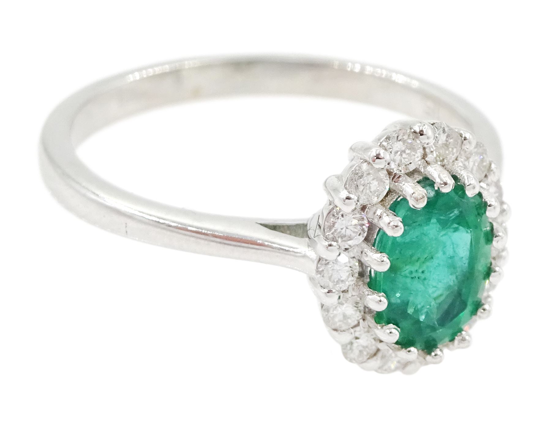 18ct white gold oval cut emerald and round brilliant cut diamond cluster ring, emerald approx 0.85 carat, total diamond weight approx 0.30 carat