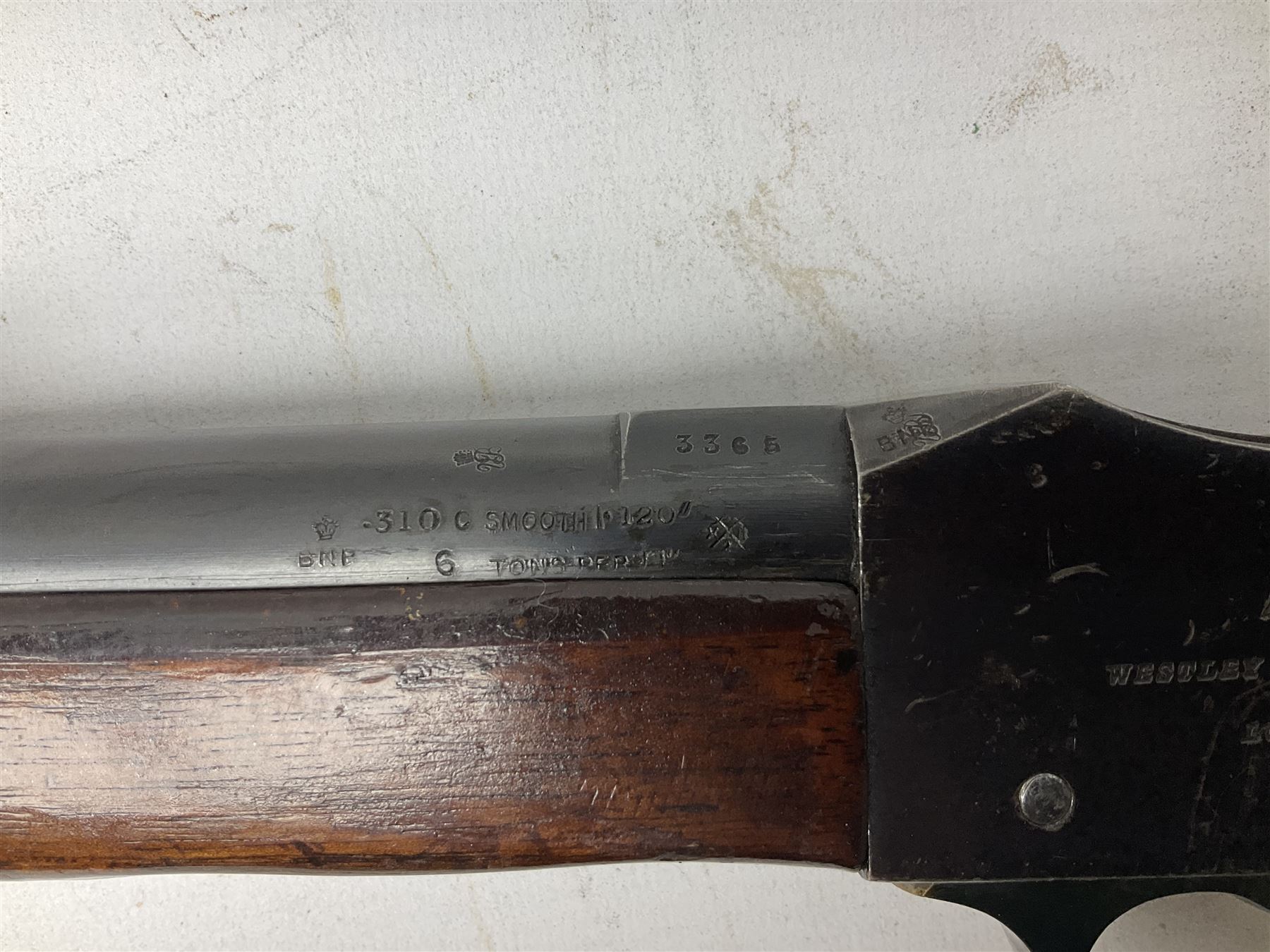 Westley Richards .310 Cadet Martini action rifle, the 63.5cm smooth bored barrel with one barrel band, walnut stock stamped 93/352 with hinged compartment to butt, serial no.3365, L103cm