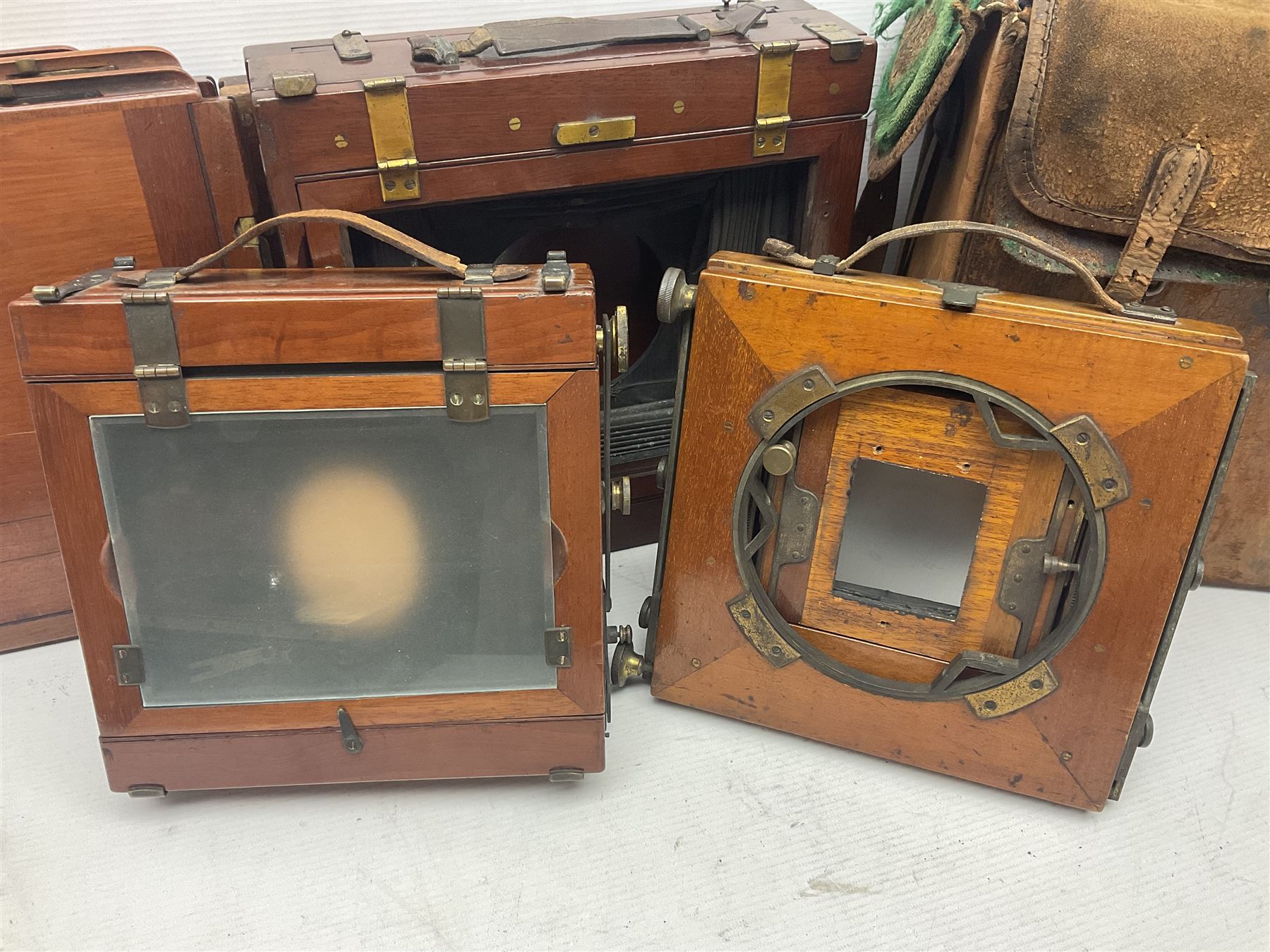 Collation of folding plate cameras of various sizes folding plate in mahogany and lacquered brass, together with camera plates and slides
By vendors repute some slide are from the Gandolfi workshop