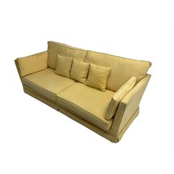 Large four seat sofa (W228cm, D95cm, H93cm), and matching armchair (W105cm, D95cm), upholstered in pale pastel yellow fabric