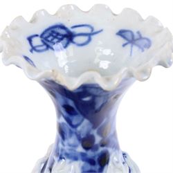 Pair of blue and white moulded vases, decorated with dragons amongst clouds, together with two blue and white planters painted, the first decorated with pagodas within a landscape scene, the other with musicians, vases H26cm 