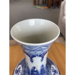 Late Qing Dynasty bottle vase decorated in blue and white with dragons and pearls, stylised leaves and flowers with key pattern foot H40cm 