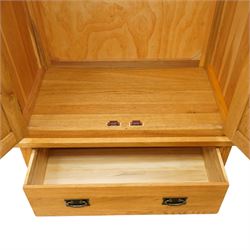 Contemporary light oak double wardrobe, fitted with two panelled cupboards over single drawer