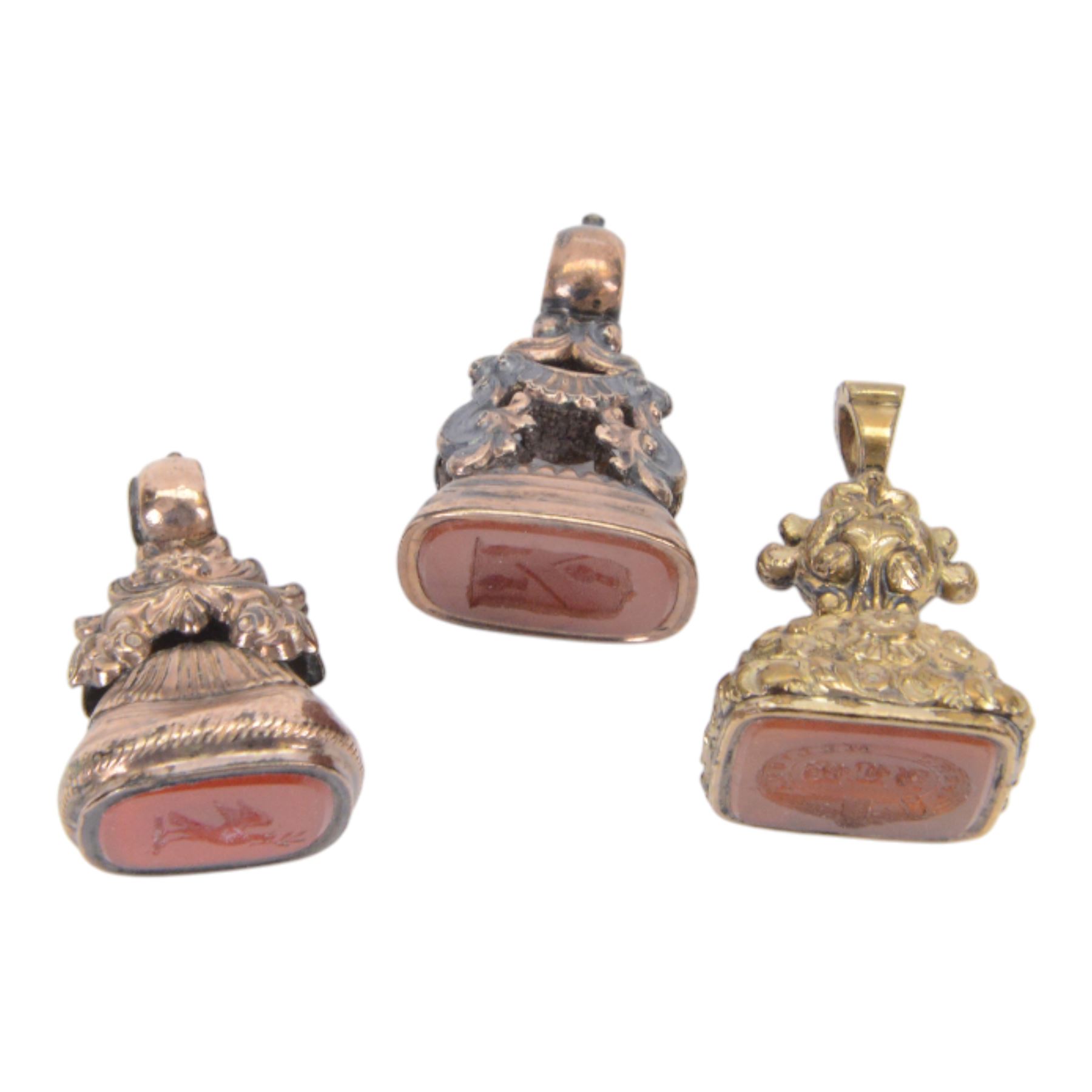 Collection of four 19th century gold plated seals with carnelian matrixes, together with three seals including an agate example, largest seal H3.5cm