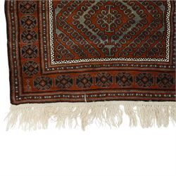 Afghan Turkmen Ersari hand-knotted rug, warm brown field decorated with a vertical arrangement of the elongated geometric guls formed by ram's horn hook motifs, enclosed by narrow ivory guard stripes, and a broad main border, with cotton fringe ends 