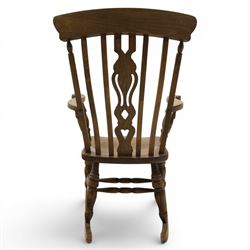 Farmhouse elm rocking chair, high back with 'Fleur De Lis' splat, shaped arms above turned supports, on rocker base 