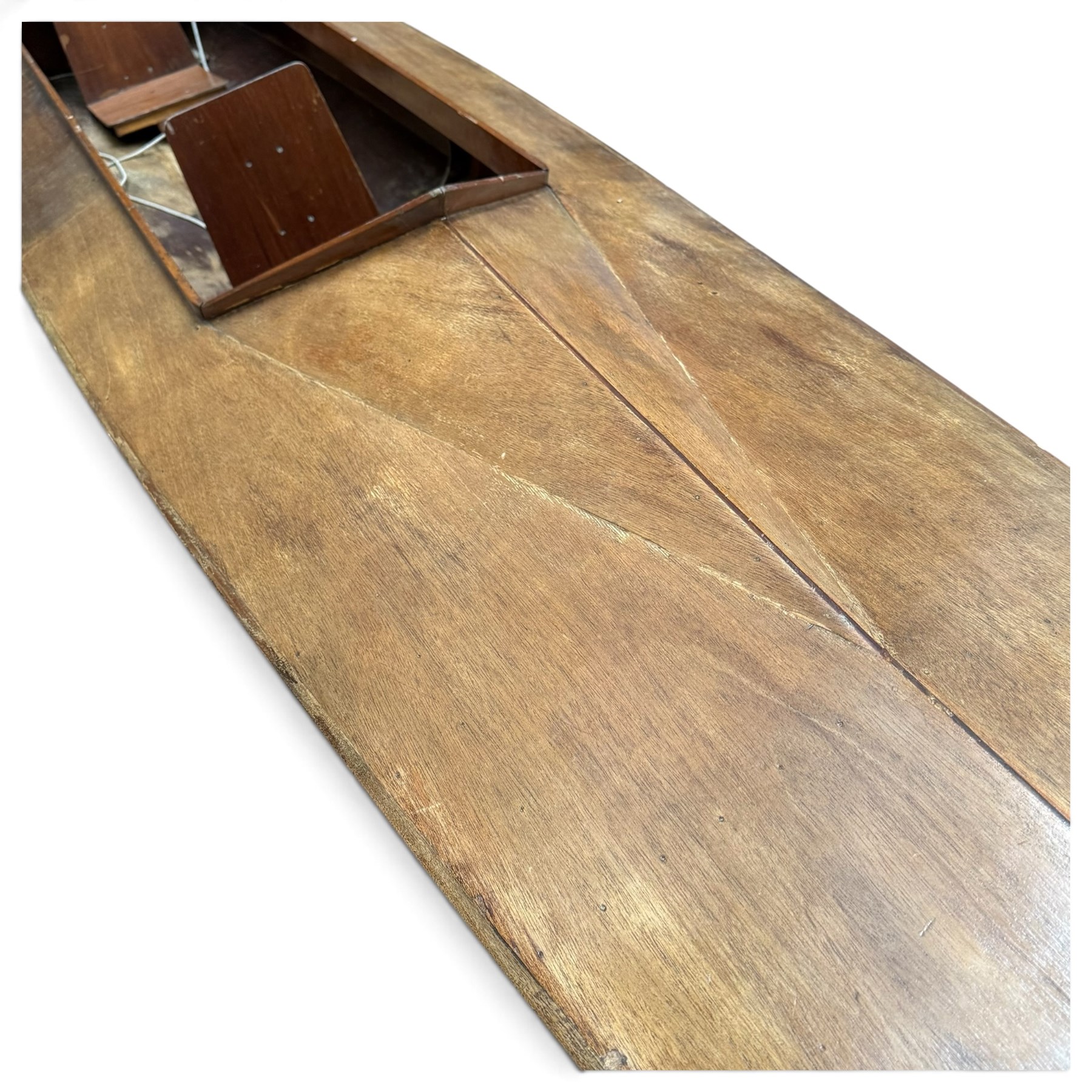 Mid-20th century varnished marine plywood two-person touring kayak, the decked hull with pointed bow and stern, two circular Holt-Allen access hatches and central open cockpit fitted with seats