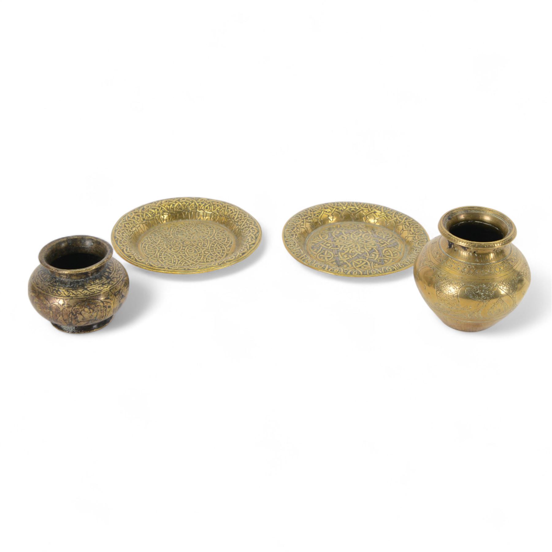 Indian miniature brass lota, decorated with peacocks, together with another similar examples and two brass dishes, largest lota H8cm 