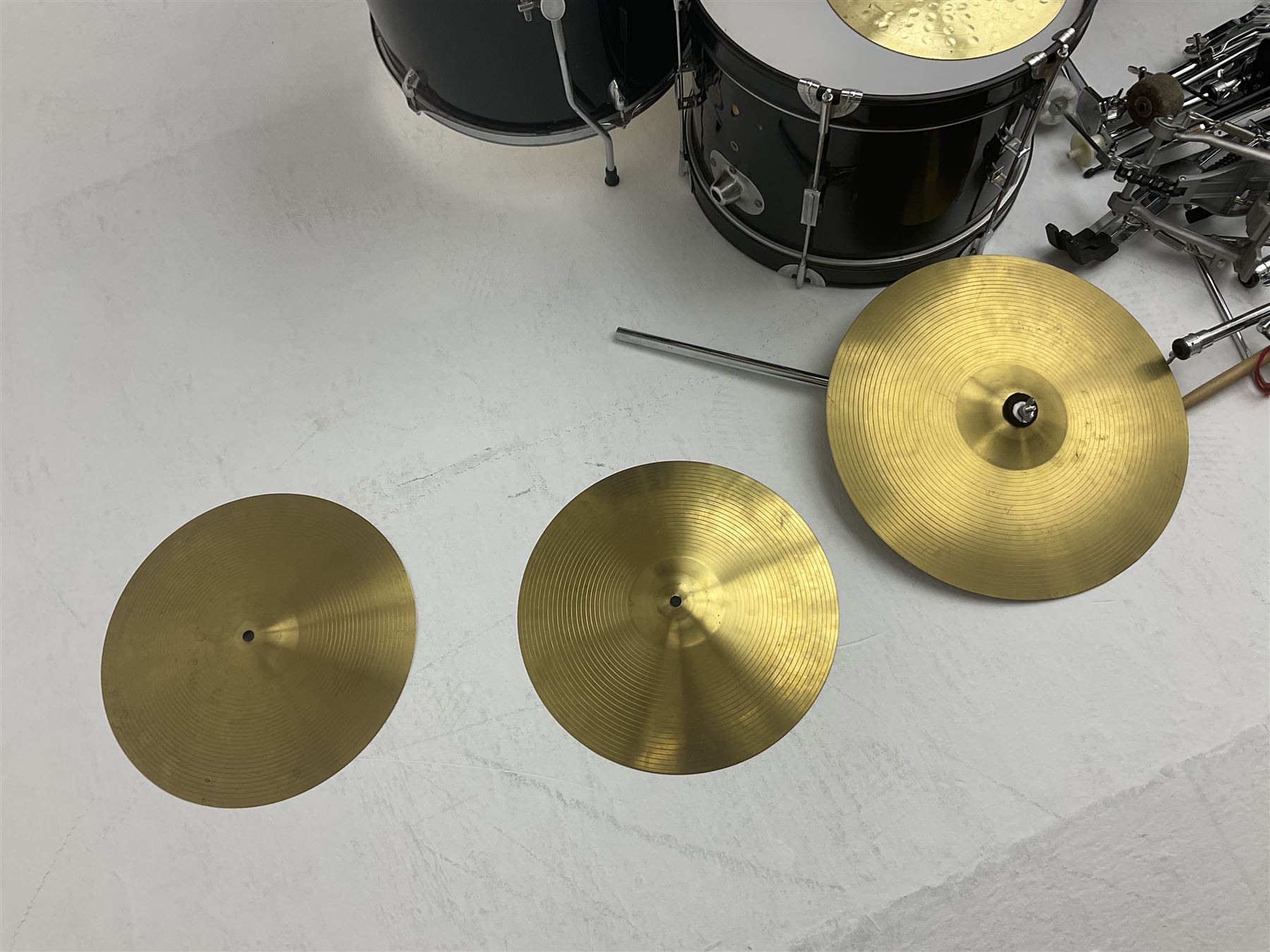 Rockburn eight-piece black drum kit with bass drum, floor tom and five other toms and snare drum; together with two other snare drums; Haosen bass drum; four cymbals; various stands, foot pedals, stool, tri-angle, drum sticks etc