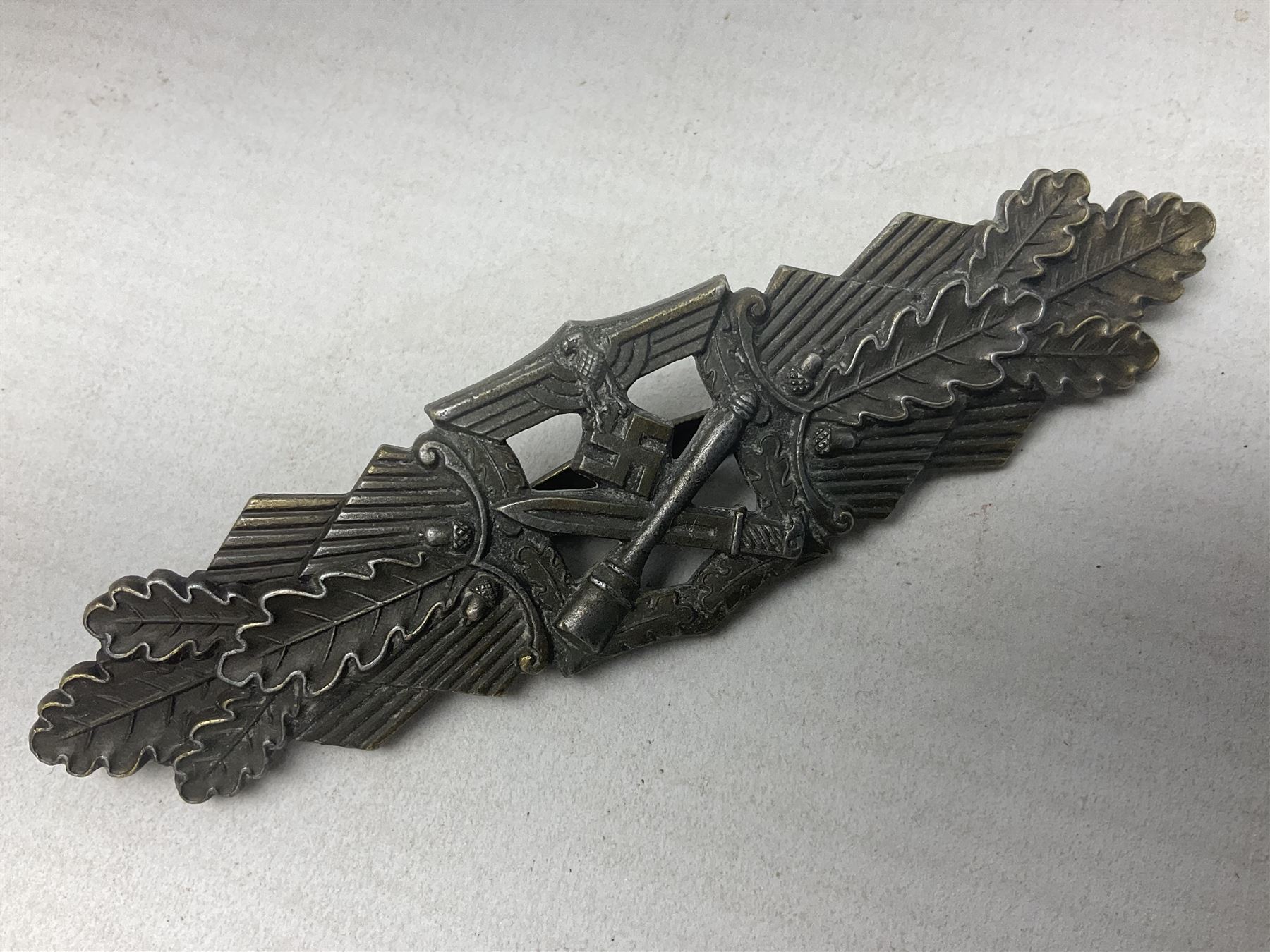 Three WW2 German badges - Close Combat Clasp; Army Flak badge; and Wound badge