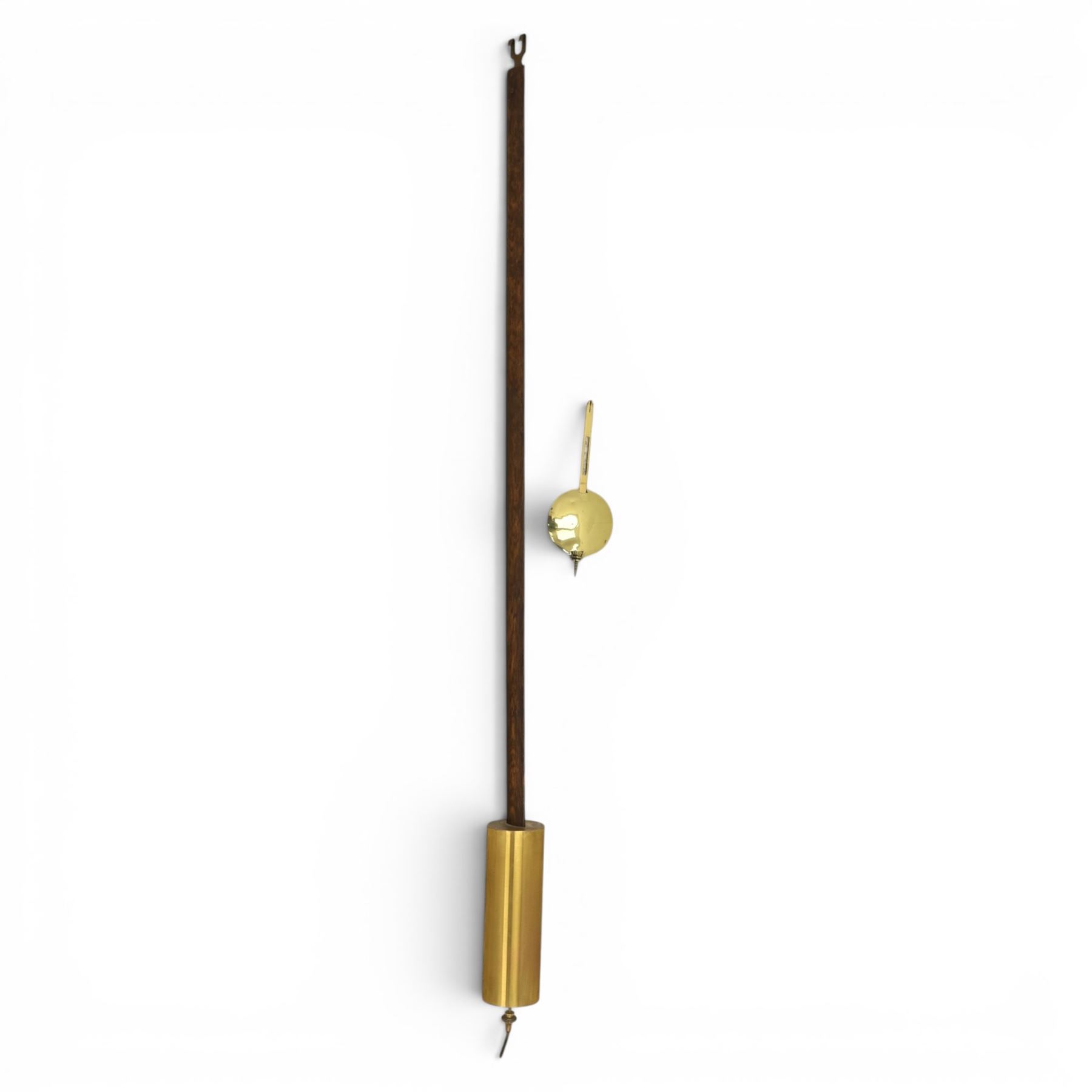 Early 20th century walnut small longcase clock, brass dial with silvered Roman numeral chapter ring and pierced black hands, the figured walnut case with shaped projecting hood, long moulded trunk door and stepped plinth base