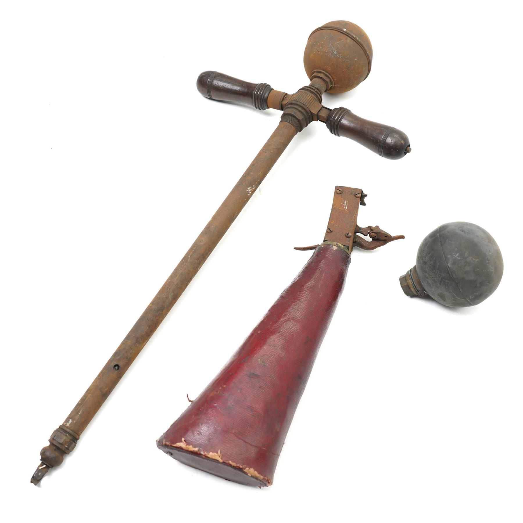 The remains of an 18th century air rifle, possibly German comprising red morocco covered butt and lock, pump with reservoir and spare reservoir 
Provenance: property of a Nobleman