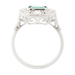 Platinum emerald and diamond dress ring, milgrain set with a single octagonal cut emerald of 1.26 carat, surrounded by round brilliant cut diamonds in an pierced design setting, stamped PT 950, total diamond weight 0.47 carat