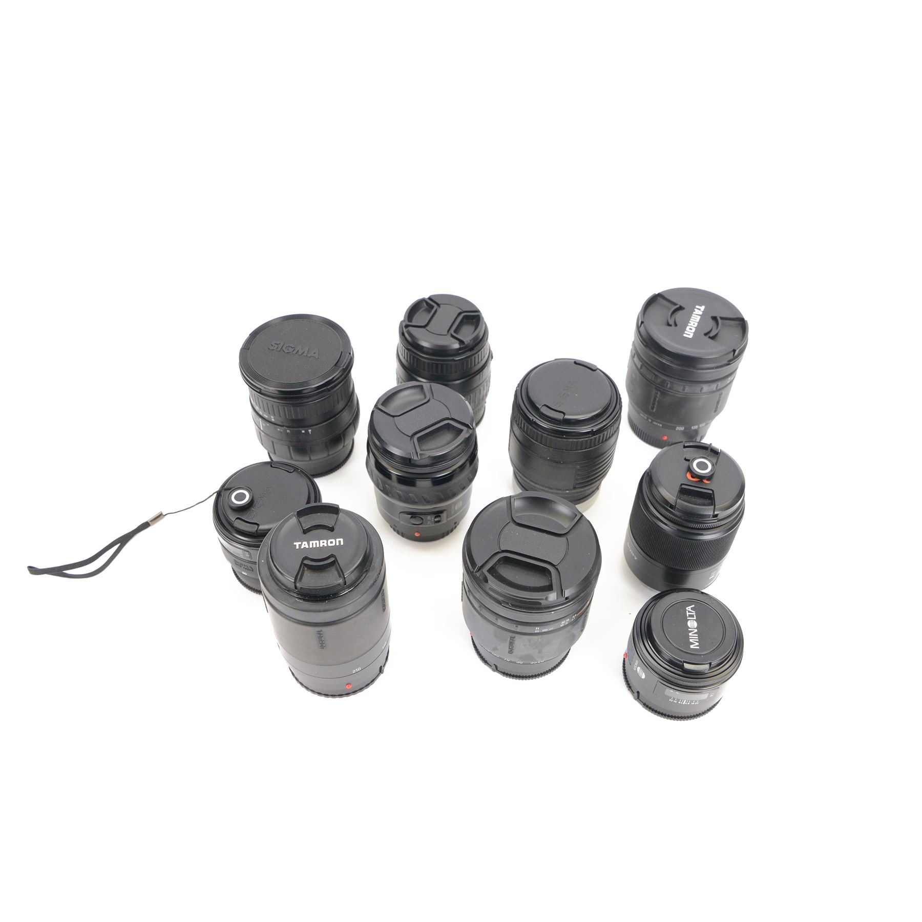 Ten camera lenses, comprising Minolta AF Zoom Xi 28-105mm 1:3.5 (22)-4.5 , Tamron AF Aspherical 28-200mm 1:3.8-5.6, two Tamron AF 80-210mm 1:4.5-5.6, Sigma Zoom 28-80mm 1:3.5-5.6 macro, Sigma Zoom 28-200mm 1:3.8-5.6 UC, Sigma UC Zoom 70-210mm 1:4-5.6, Sony DT 3.5-5.6/18-70 0.38m/1.3ft macro, Minolta AF 50mm 1:1.7 and Sigma Zoom Master 1:3.5-4.5 f=35-70mm