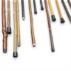 Collection of modern walking sticks, ebonised evening canes, thumb stick and shooting stick etc 