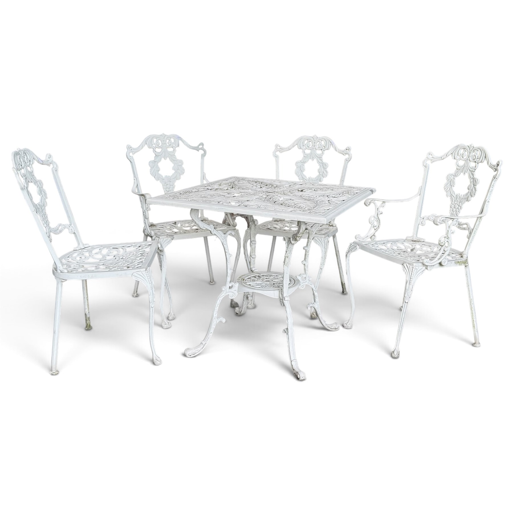Regency design white-painted aluminium garden table, square pierced top with scrolling acanthus leaf decoration, splayed supports joined by pierced circular under-tier (W75cm H72cm), the chairs with scrolling and floral garland design backs over pierced foliate seats with cabriole supports (W48cm H90)