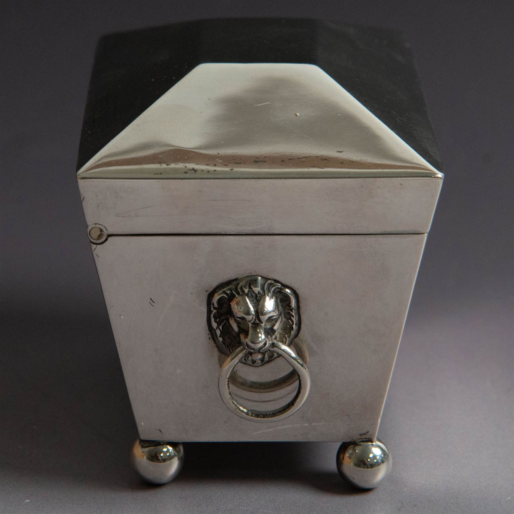 Early 20th century silver tea caddy, of sarcophagus form with twin lion mask mounted loop handles, upon four bun feet, hallmarked William Hutton & Sons Ltd, Birmingham 1913, H8cm, W9cm