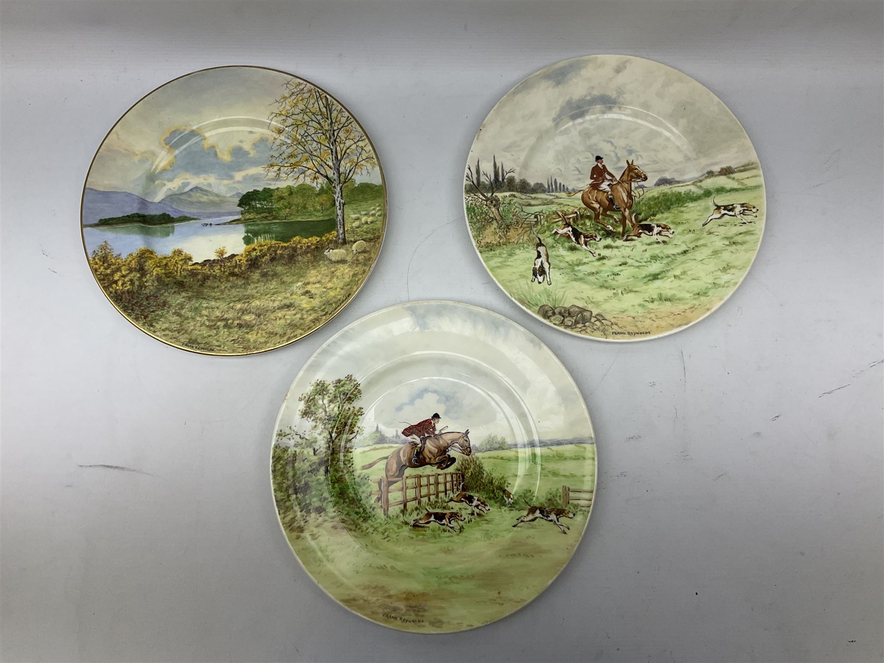 Four Frank Reynolds figures of ladies together with five plates painted by the same artist