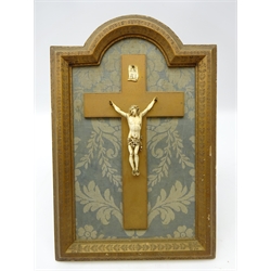  19th century Continental carved ivory Corpus Christi with ivory INRI on a giltwood cross, mounted within giltwood frame, H37cm x W24cm overall  