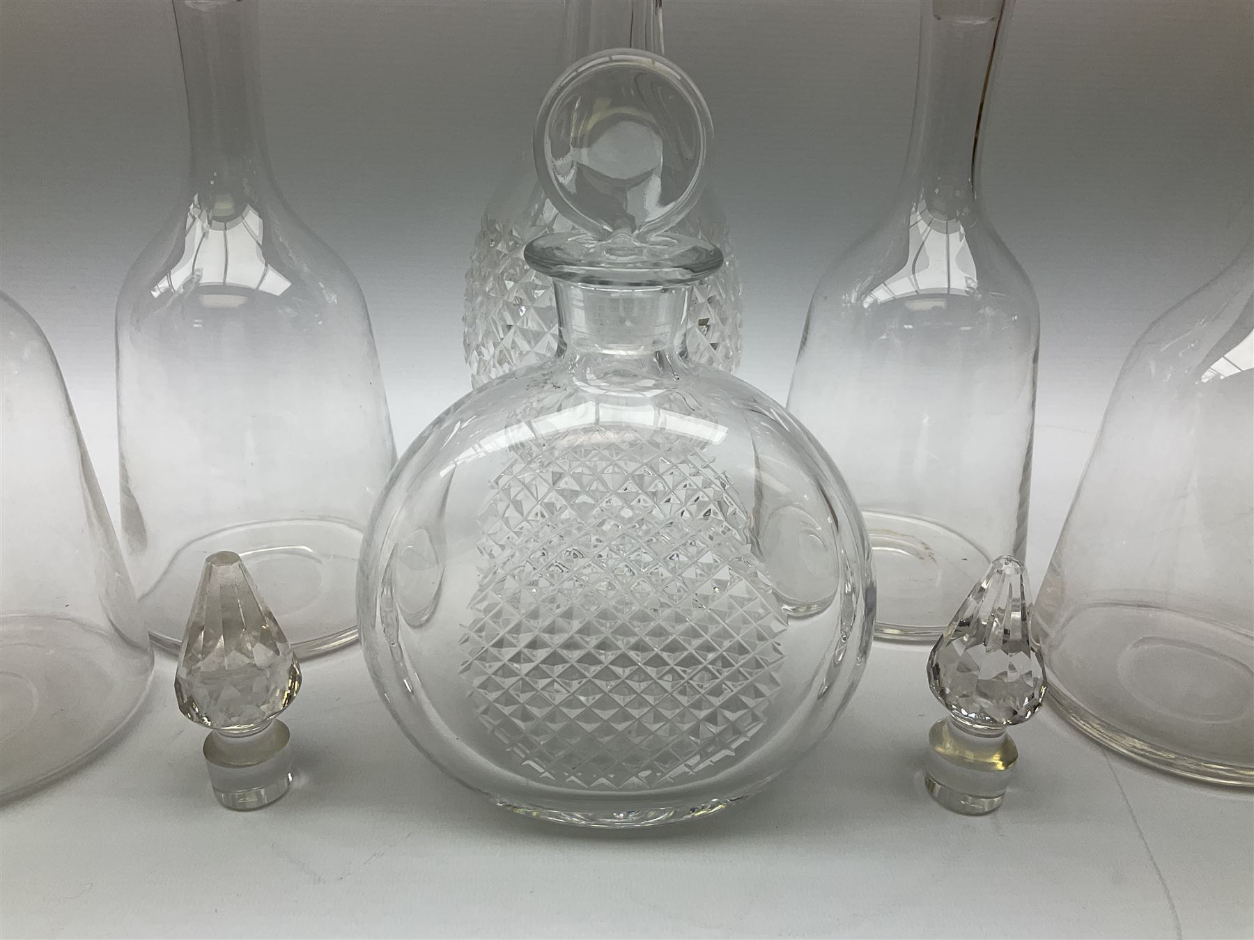 Waterford Crystal Coleen pattern cut glass decanter, together with a set of four plain mallet shaped decanters, and a further decanter of flask form, (6)