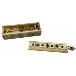 Small rectangular Scrimshaw box containing twenty three miniature Whale Bone dominoes, sliding top decorated with roundels, the sides inscribed, 'Love Me' L9cm, W2.25cm, H1.75cm