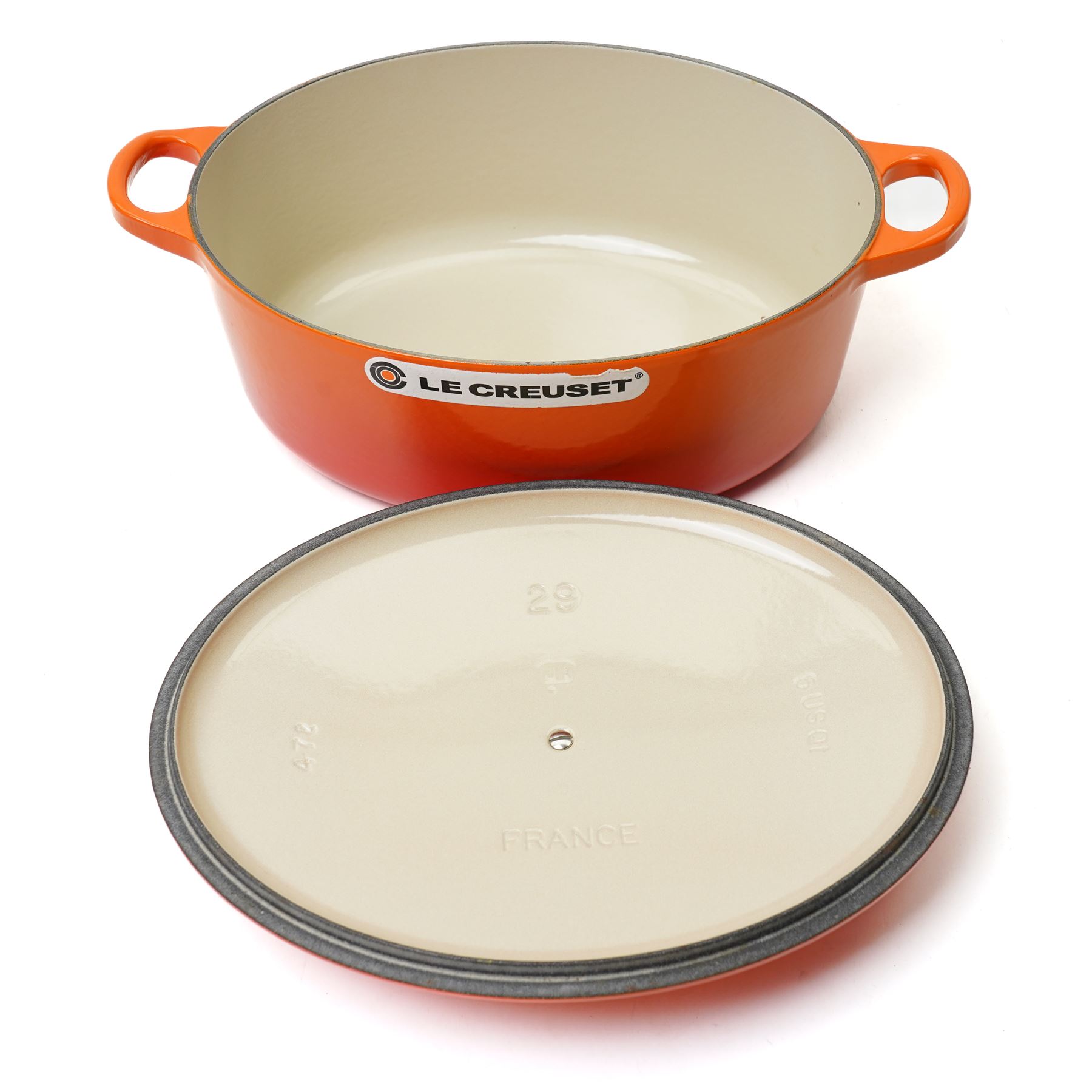 Le Creuset oval casserole dish and cover,  and another shallow example, in the Volcanic colourway