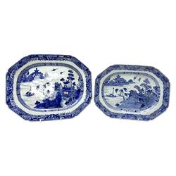 Two late 18th/early 19th century Chinese export blue and white platters, of canted form, decorated with a landscape set with pagodas and sailboat between islands, within diaper and foliate, moth, and stylised key border, largest example W36cm, smaller W32cm