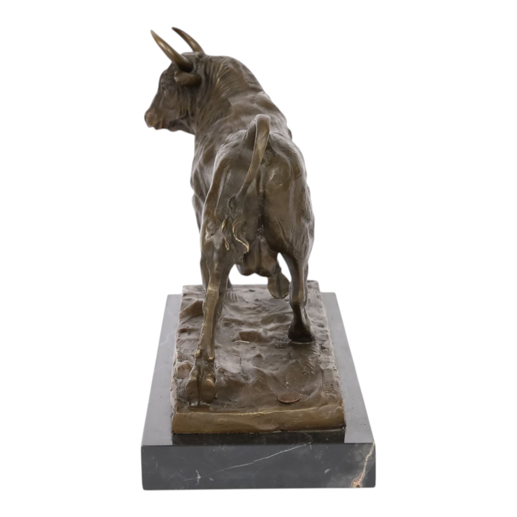 Bronze figure, modelled as a bull, upon naturalistically modelled rectangular base signed Milo and with foundry mark, raised upon black marble base, H27cm L36cm