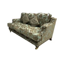Wade - 'Kempston' three seat sofa, upholstered in chenille fabric with brocade pattern, raised on mahogany finish square tapering block feet with heavy brass castors