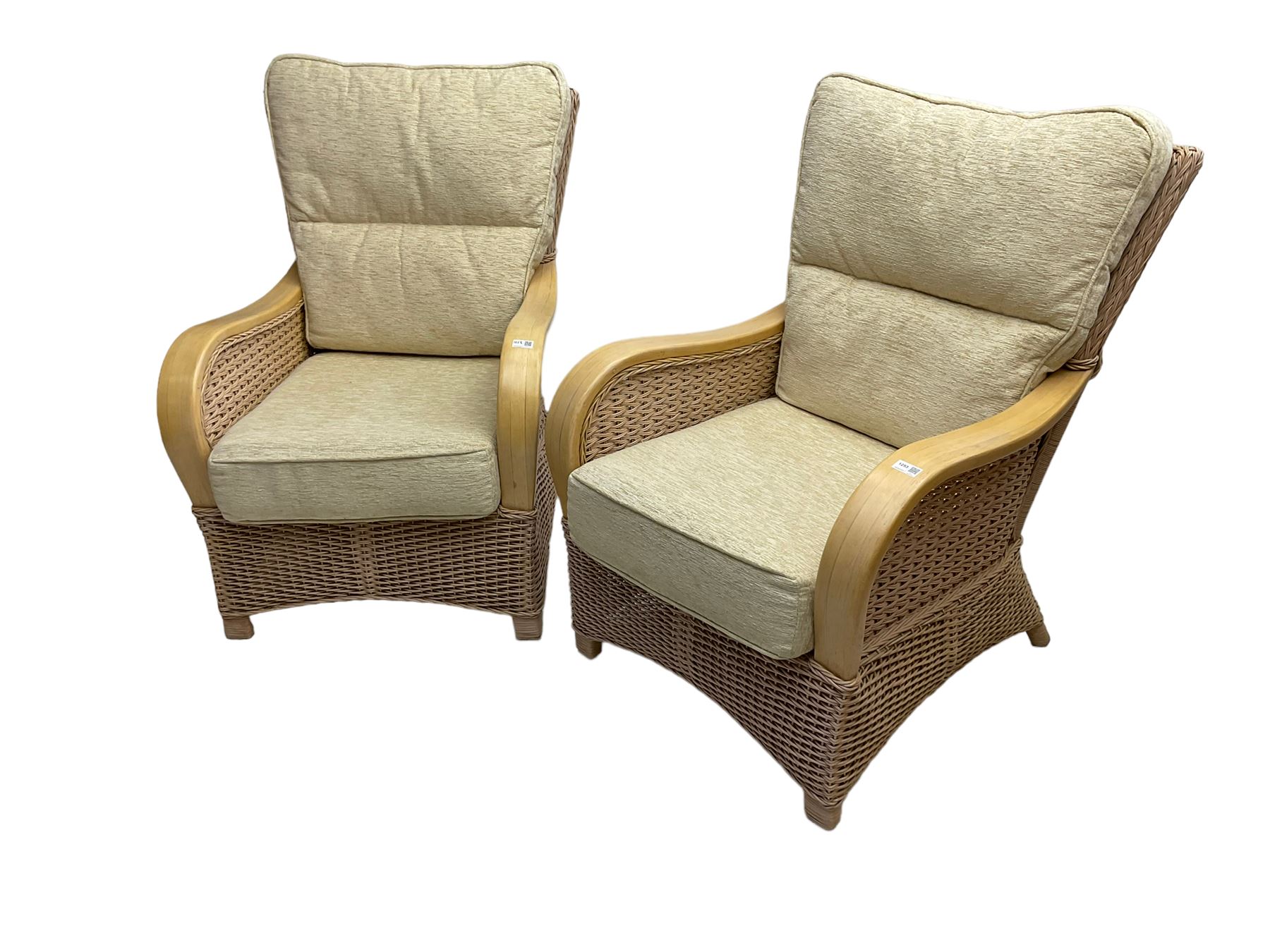 Contemporary rattan conservatory suite - two seat sofa with wicker frame and loose cushions upholstered in textured champagne fabric (W125cm H98cm); pair of matching armchairs (W72cm H98cm); rectangular glass-topped coffee table with rattan frame and undertier (W85cm D60cm H47cm); and matching square side table (W53cm H55cm)