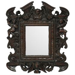 Renaissance-style mid 19th century carved fruitwood wall mirror, carved top surmounted by ...