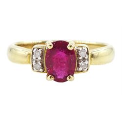 9ct gold single oval cut ruby and four stone, round brilliant cut diamond ring, hallmarked...