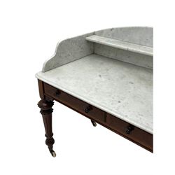 Victorian figured mahogany two-piece bedroom set - the washstand with white and black marble moulded top with arched back and raised shelf, two moulded frieze drawers, on turned and fluted supports with brass and ceramic castors (W123cm, D60cm, H102cm); the dressing table with raised swing mirror in moulded frame with shell and scroll carved pediment, on scrolled horns carved with foliage, four raised trinket drawers over moulded rectangular top, fitted with two drawers, on turned and fluted supports with brass and ceramic castors (W122cm, H177cm, D62cm)