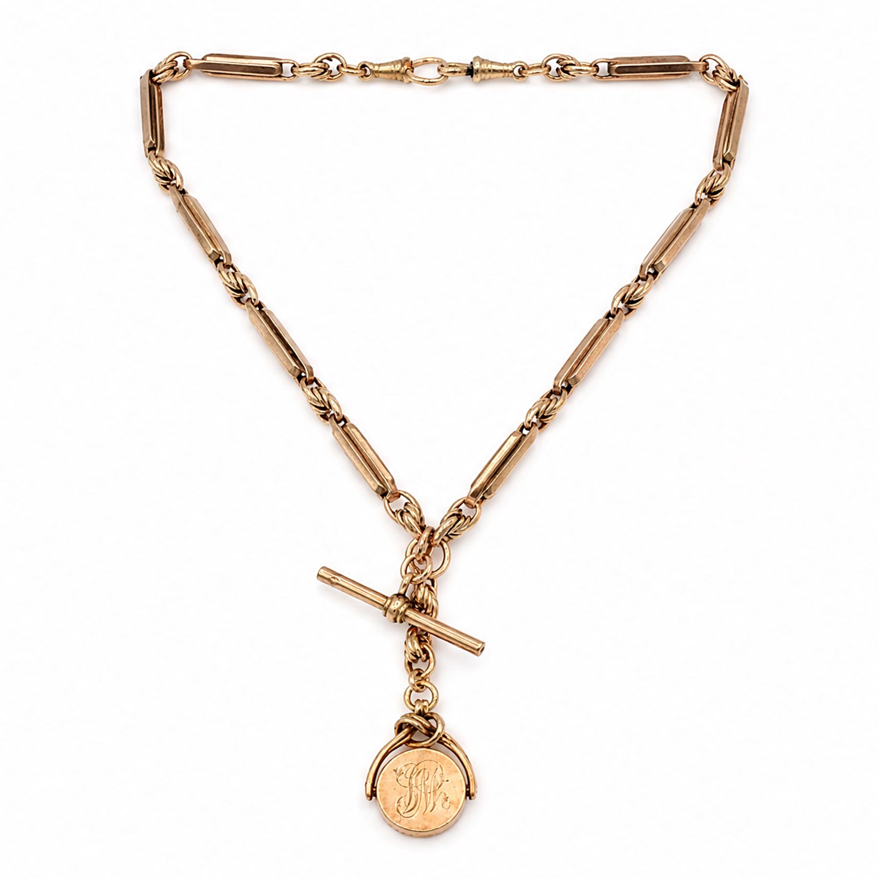 Early 20th century 9ct rose gold fancy link Albert chain, with rose gold swivel fob, monogrammed with initials, Birmingham 1923 